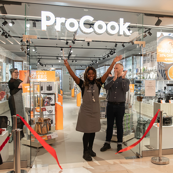 ProCook staff member cutting ribbon to open new store