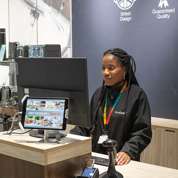 ProCook staff member working on a till
